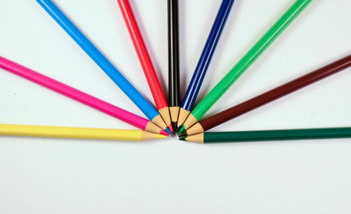 Naklejka premium Different color wooden pencils on white background