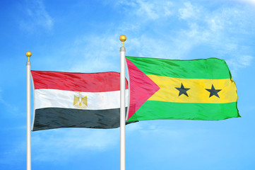 Egypt and Sao Tome and Principe two flags on flagpoles and blue cloudy sky