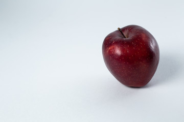 red apple lies on a white background