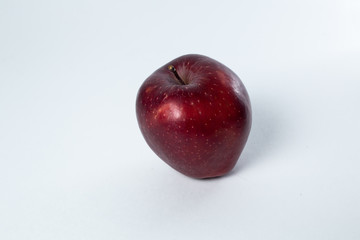 red apple lies on a white background
