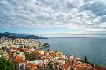 Aerial view with the city of Kavala in northern Greece,  surrounded by turqoise sea