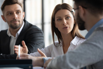 Attractive manager businesswoman conducts coaching in boardroom at company meeting. Close up...