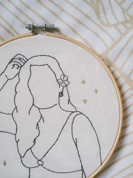 Embroidery frame girl flower hair