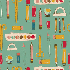 Vector blue seamless pattern with school supplies.