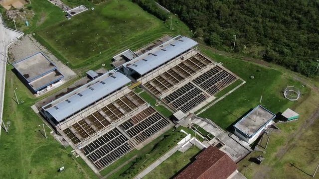 Aerial top view recirculation solid contact clarifier sedimentation tank, Water treatment plant Papallacta