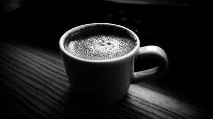 Black and white cup of coffee.