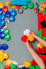 Multi-colored children's developing game designer on a gray background