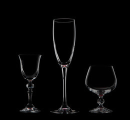 
Three glass goblets on a black background