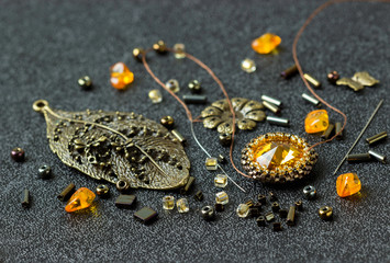 Materials and tools for making jewelry with amber. Needlework.