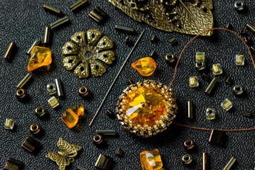 Materials and tools for making jewelry with amber. Needlework.