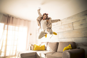 Concept of end quarantine coronavirus covid-19 lockdown stay home time - woman jump with joyful and...