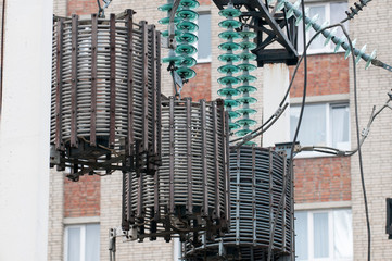 Line traps, also called wave traps, suspended under a high voltage power line pylon.