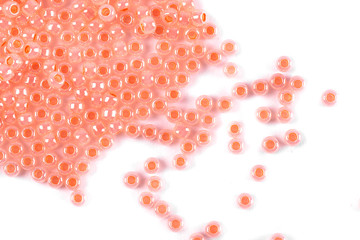 Isolated beads on a white background, scattered beads, pink beads