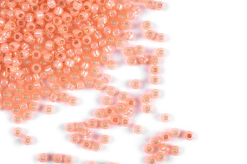 Isolated beads on a white background, scattered beads, pink beads