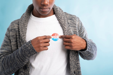 African american election voter wears I voted today pin
