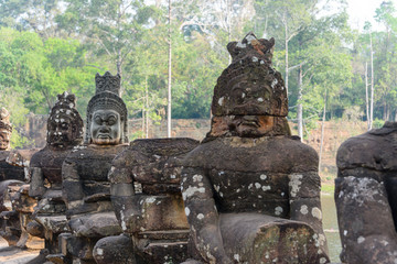 Statues line the entrance to the Unesco World Heritage site of Ankor Thom, Siem Reap, Cambodia