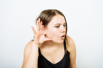 Overhears a woman, tries to listen.