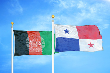 Afghanistan and Panama  two flags on flagpoles and blue cloudy sky