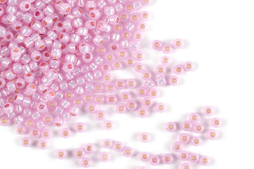 Isolated beads on a white background, scattered beads, pink beads