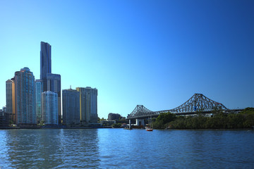 Story bridge and skyscrapers under blue skies in Brisbane, Australia