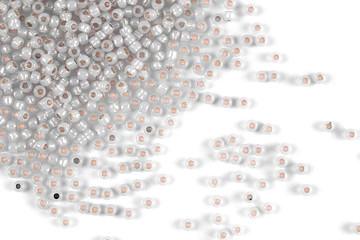 Isolated beads on a white background, scattered beads, grey beads