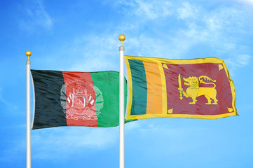 Afghanistan and Sri Lanka  two flags on flagpoles and blue cloudy sky