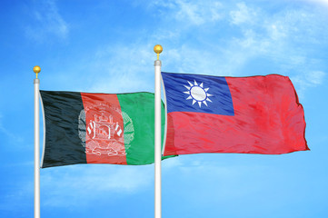 Afghanistan and Taiwan  two flags on flagpoles and blue cloudy sky