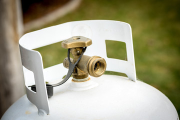 Single close up of a propane take in a backyard