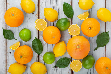 Citrus fruits for Immunity boosting and cold remedies, top view, wooden background