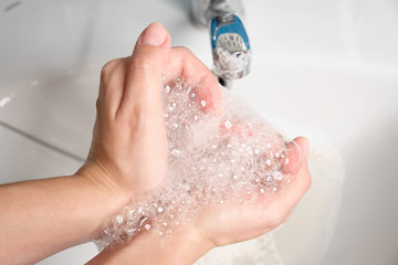 Fototapeta premium Wash your hands with soap and running water. Hygiene