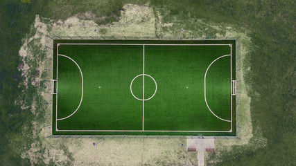 aerial veiw of empty green football field. drone shot