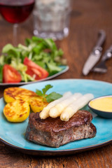 asparagus with potatoes and a steak
