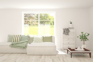 White living room with sofa and summer landscape in window. Scandinavian interior design. 3D illustration