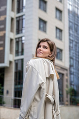 smiling girl walking in the street city 