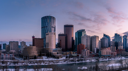 Calgary's skyline on a winter sunset with the Bow River in the foreground. 