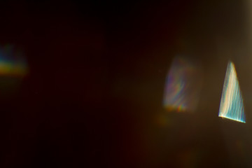 Lens flare and light leak haze texture on a black background.