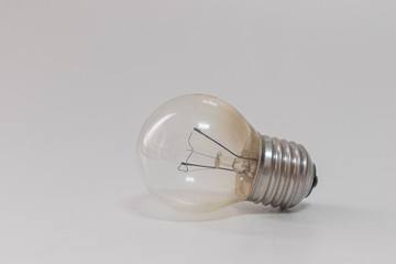 Light bulb turned off, horizontally, isolated on a plain white background