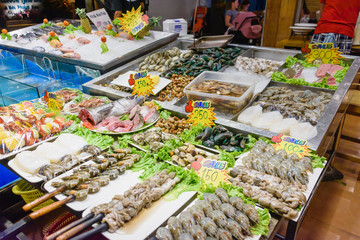 Tiger prawns, crabs, squid, octopus prepared and ready to be cooked at a Thai fish market.