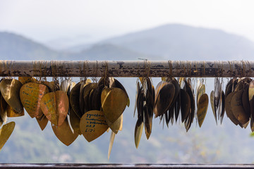 Messages of peace and love written on bronze hearts at the Big Buddha, Phuket, Thailand