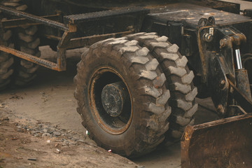 Old tractor and truck wheels, detail of old worn and damaged tires