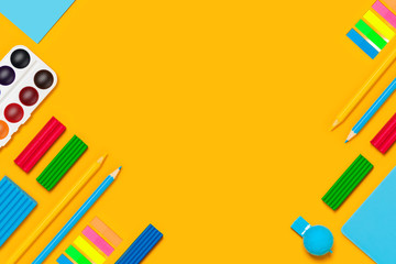 School supplies on yellow background. Back to school picture.