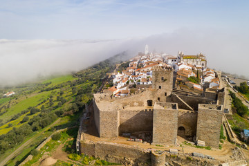 Obraz premium Monsaraz drone aerial view on the clouds in Alentejo, Portugal