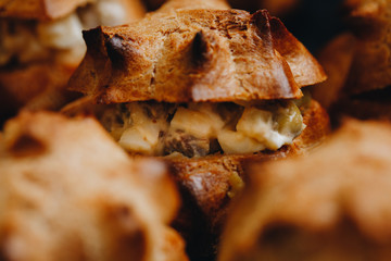 Set of coffee break in the hotel during conference meeting, with tea and coffee catering, decorated catering banquet table with variety of different pastry and bakery, with croissants and cookies