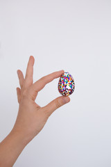 Woman holding glitter easter egg