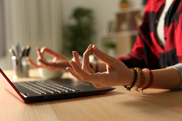Student girl hands stress relieving doing yoga at night