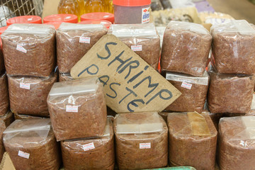 Bags of shrimp paste for sale at a Thai market stall, Thailand