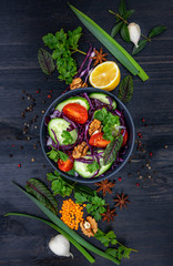 Large colorful group of vegetable and fruits on a dark wooden background with copy space, top view, selective focus, flat lay. Healthy eating concept.