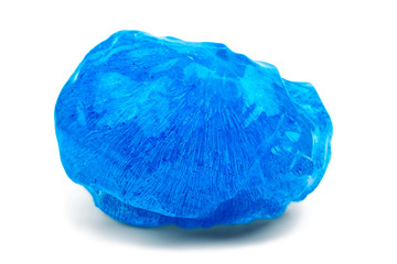 A piece of blue ice on a white background