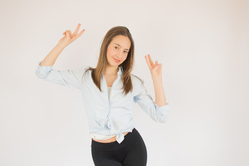 Beautiful young girl making a victory pose
