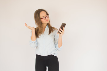 Beautiful young girl with glasses and mobile